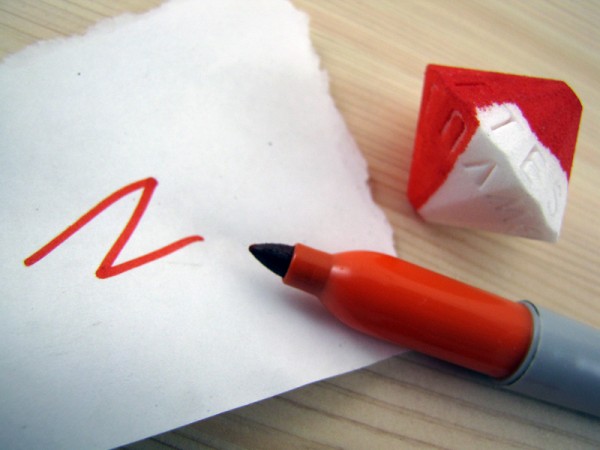 Orange Sharpie, with half-colored Alphabet Die print, and color on white paper.