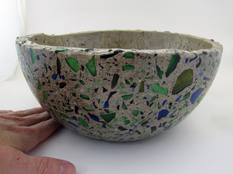 glass-aggregate-concrete-bowl-with-hand-for-scale