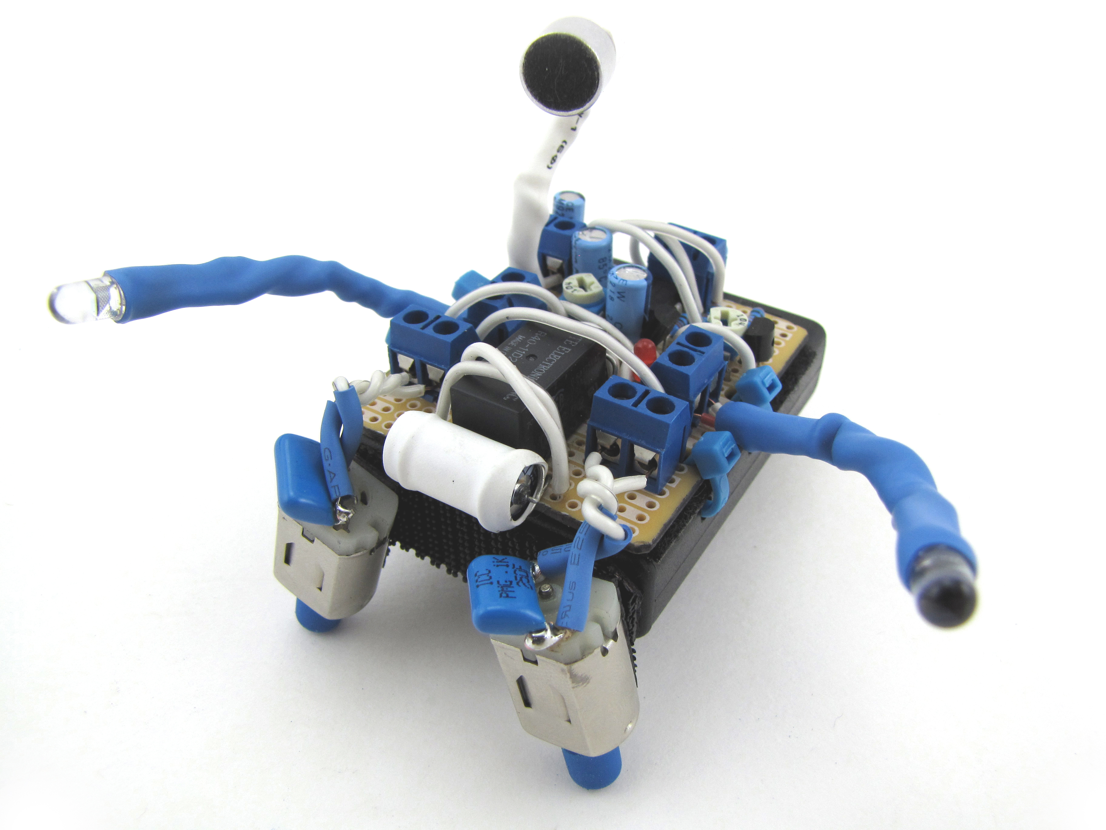 An elaborate but small hand-assembled BEAM style robot with carefullly coordinated colors in blue and white.
