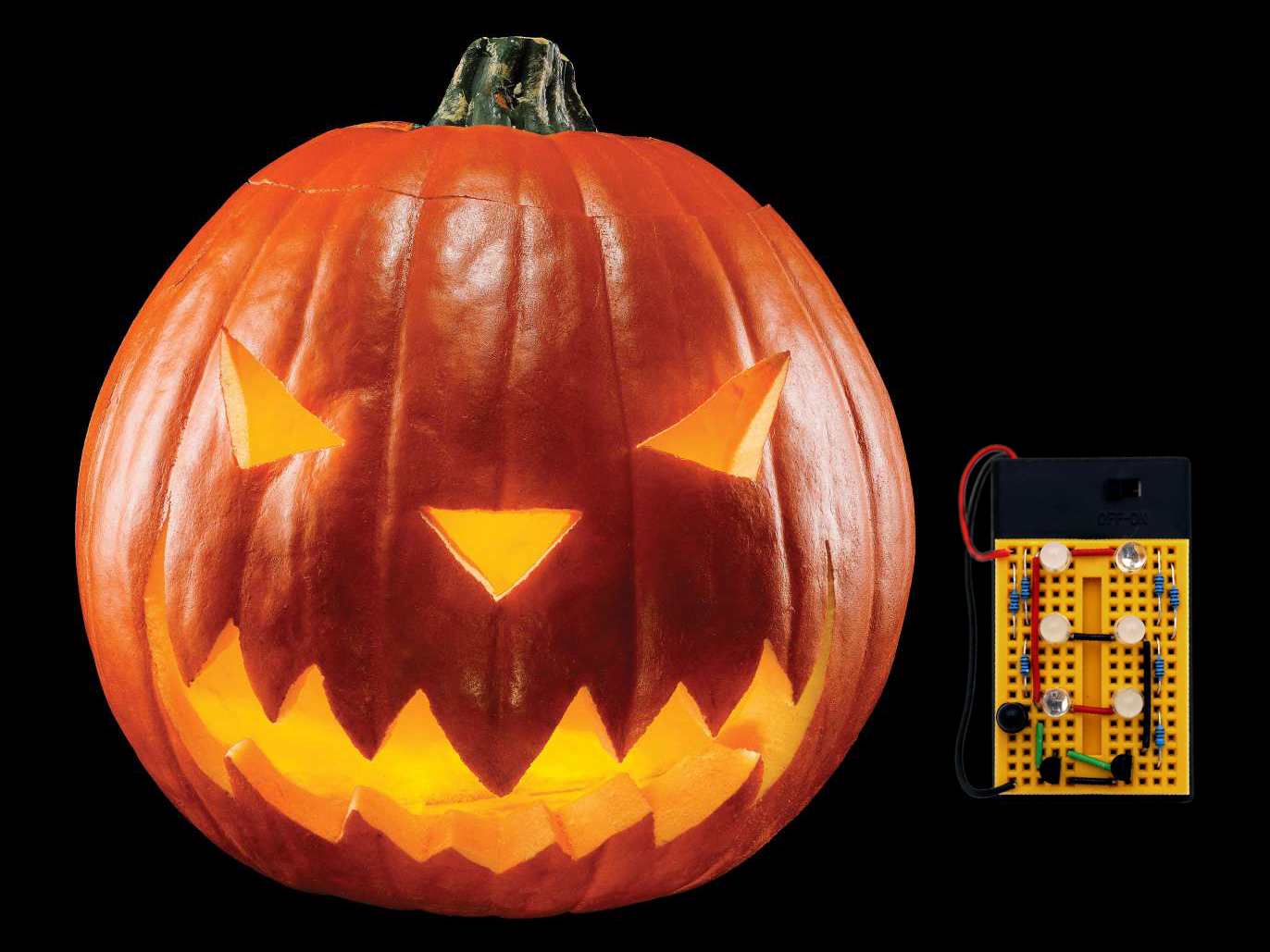 Complete "Hack-o'-lantern" and mini breadboard that goes inside